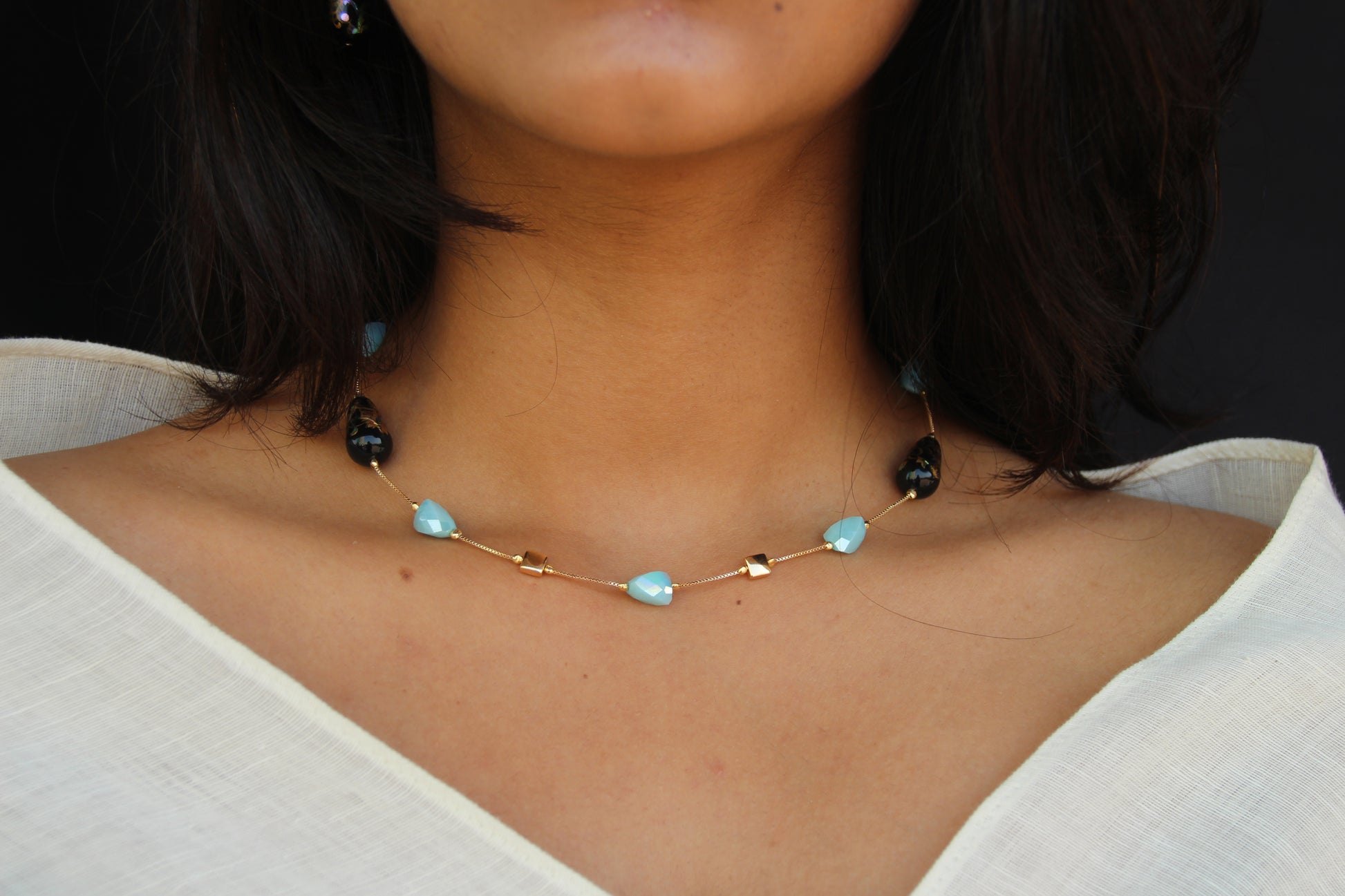 Almond Shaped Light Blue Crystals and Black Japanese Beads