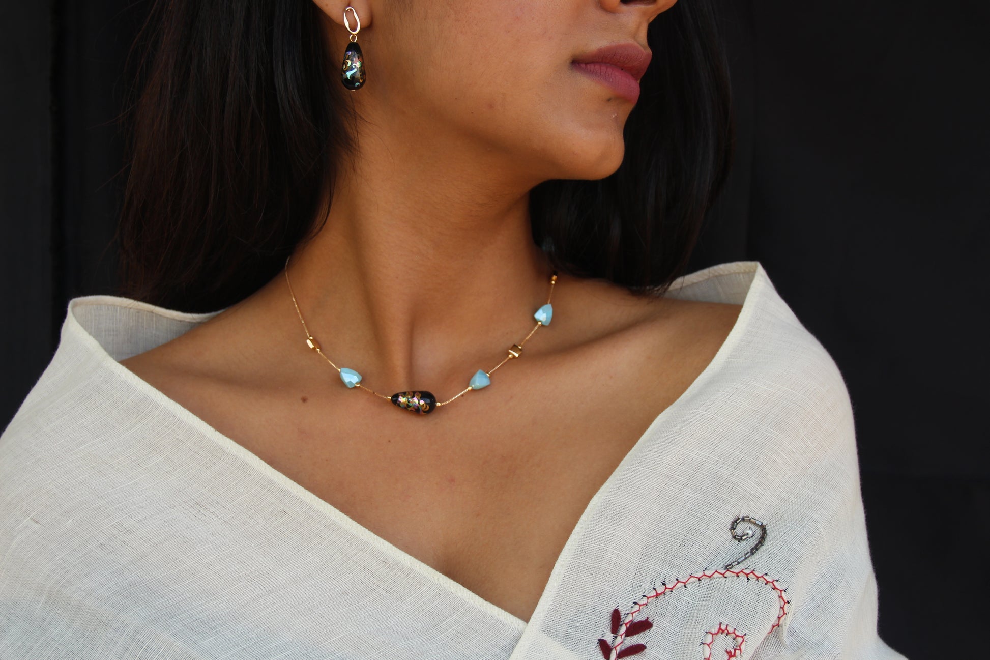 Almond Shaped Light Blue Crystals and Black Japanese Beads