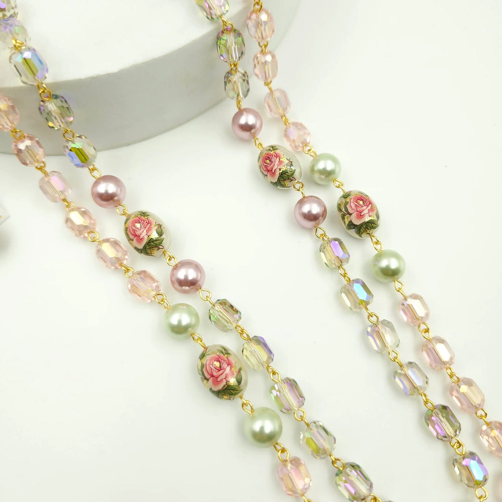 Necklace with floral beads on a white background