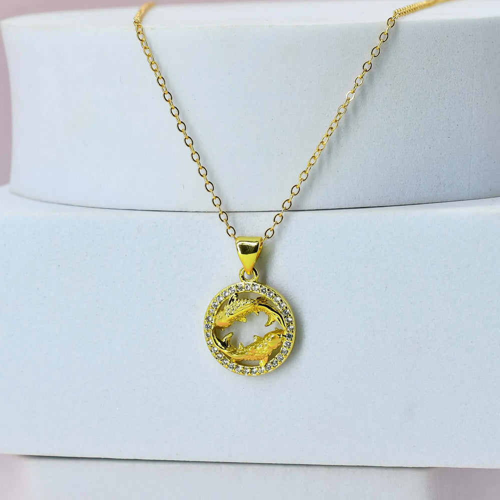 Gold Plated chain with a Pisces pendant on a white stand