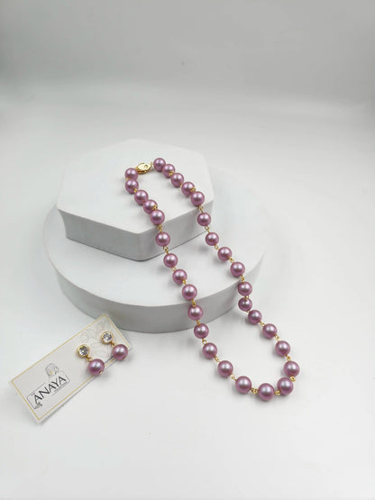 Purple pearl necklace with a tag on a white background